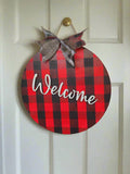 Red buffalo check welcome sign – laser-cut Baltic Birch 12 inch round with hand-painted plaid pattern and jute hanger