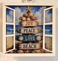 "3.4" acrylic beach Christmas suncatcher in white open window frame featuring a driftwood sign post with Joy, Peace, Love, Beach, seashells, and starfish on a coastal ocean background – by Illuminated Engraving"